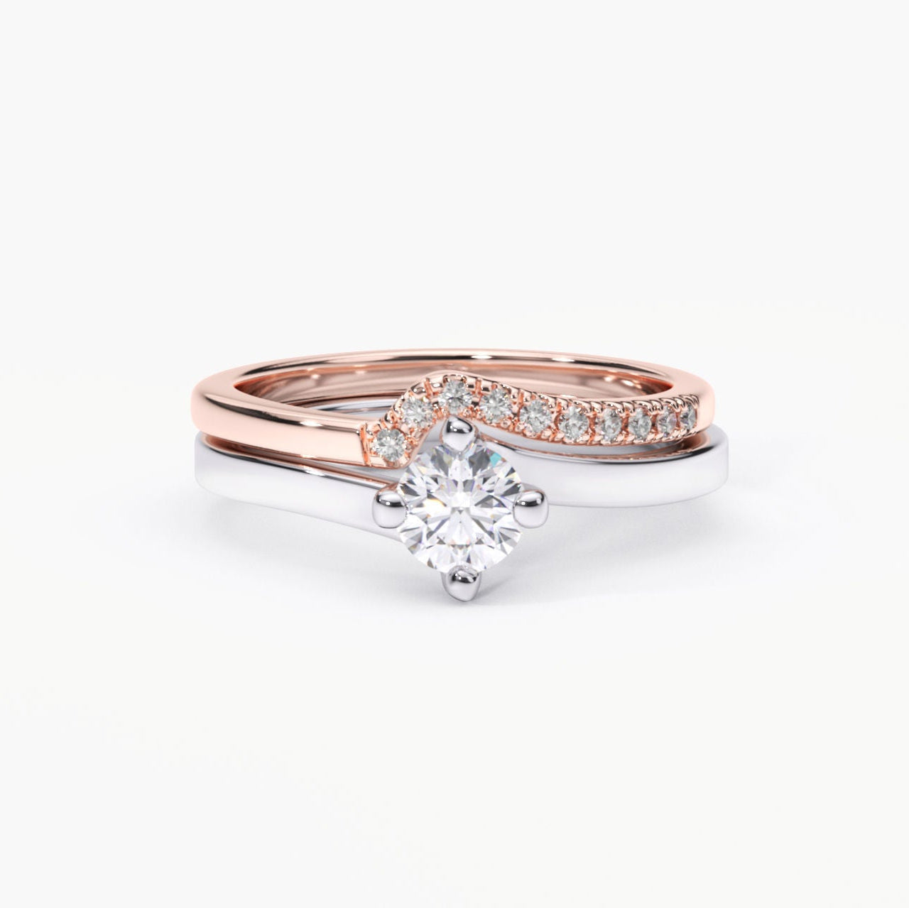 Two-tone engagement ring set with a solitaire lab-grown diamond and a curved rose gold band adorned with accent lab-grown diamonds.